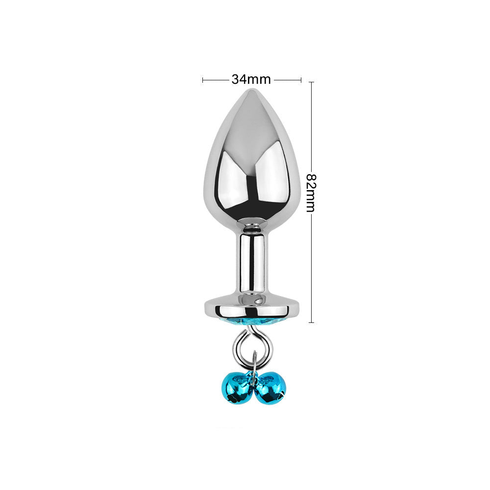 Tapón anal con joyas azules, cascabeles y correa