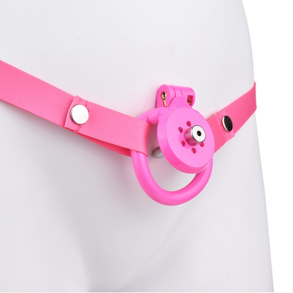 "Compact and stylish pink chastity cage perfect for male chastity devices and chastity cuck dynamics."