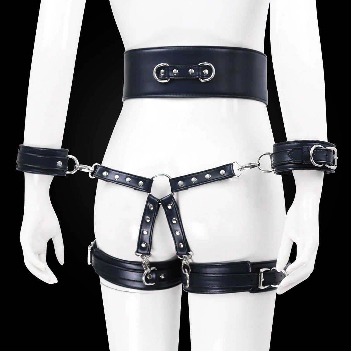 Black BDSM bondage leg cuffs set with silver accents