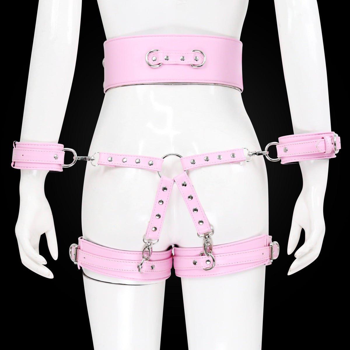 Pink BDSM bondage leg cuffs set with silver details