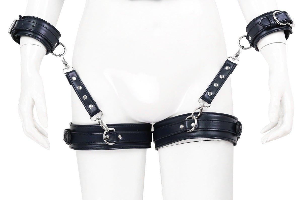 Black BDSM bondage leg cuffs with arm restraints