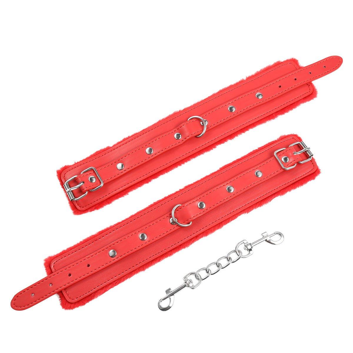 Red fur-lined BDSM wrist restraints with chain