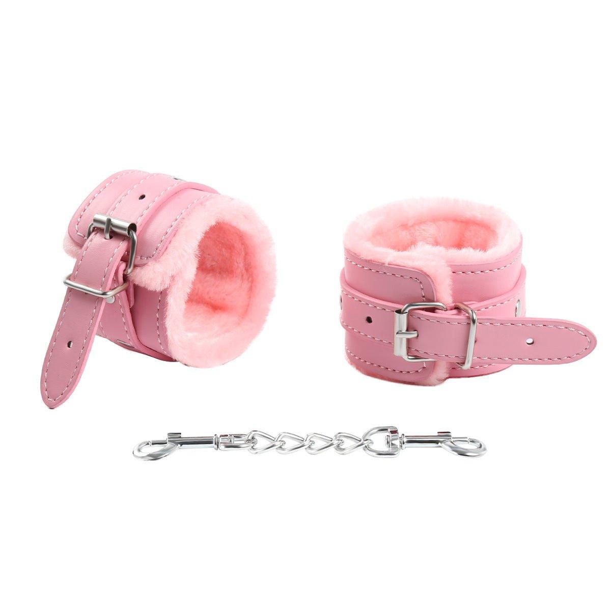 Pink fur-lined BDSM handcuffs with chain