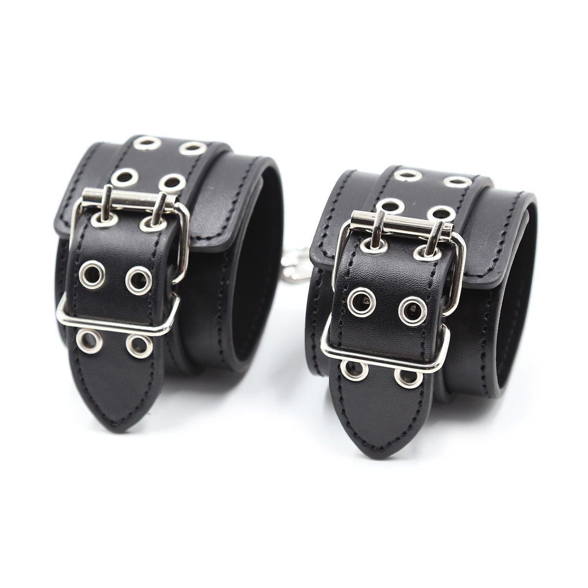 Close-up of BDSM handcuffs with buckle and studs