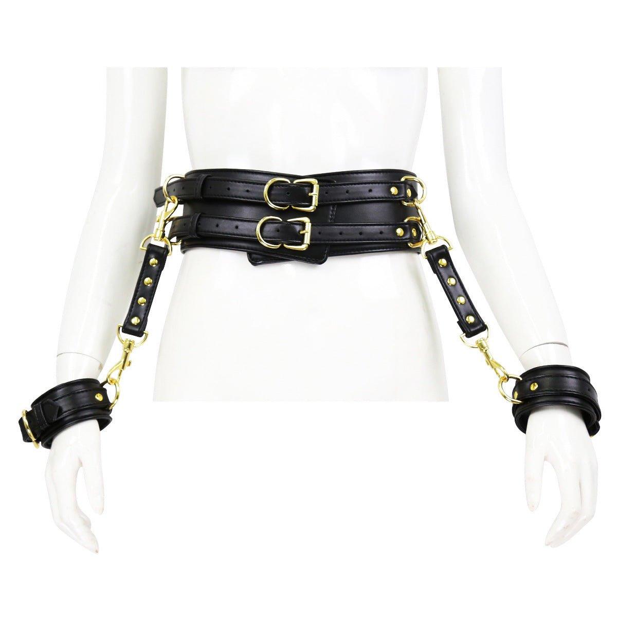 Black BDSM bondage waist and hand cuffs with gold accents