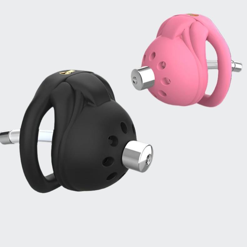 Black and pink male chastity cages side view