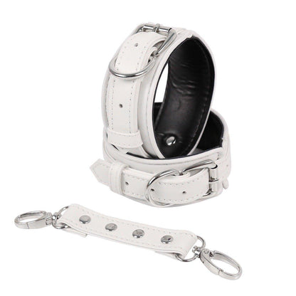 White faux leather hand cuffs with silver buckles