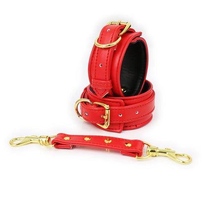 Red faux leather hand cuffs with gold buckles