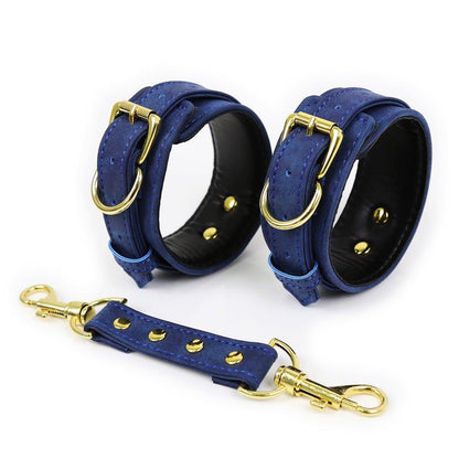 Blue faux leather hand cuffs with gold buckles