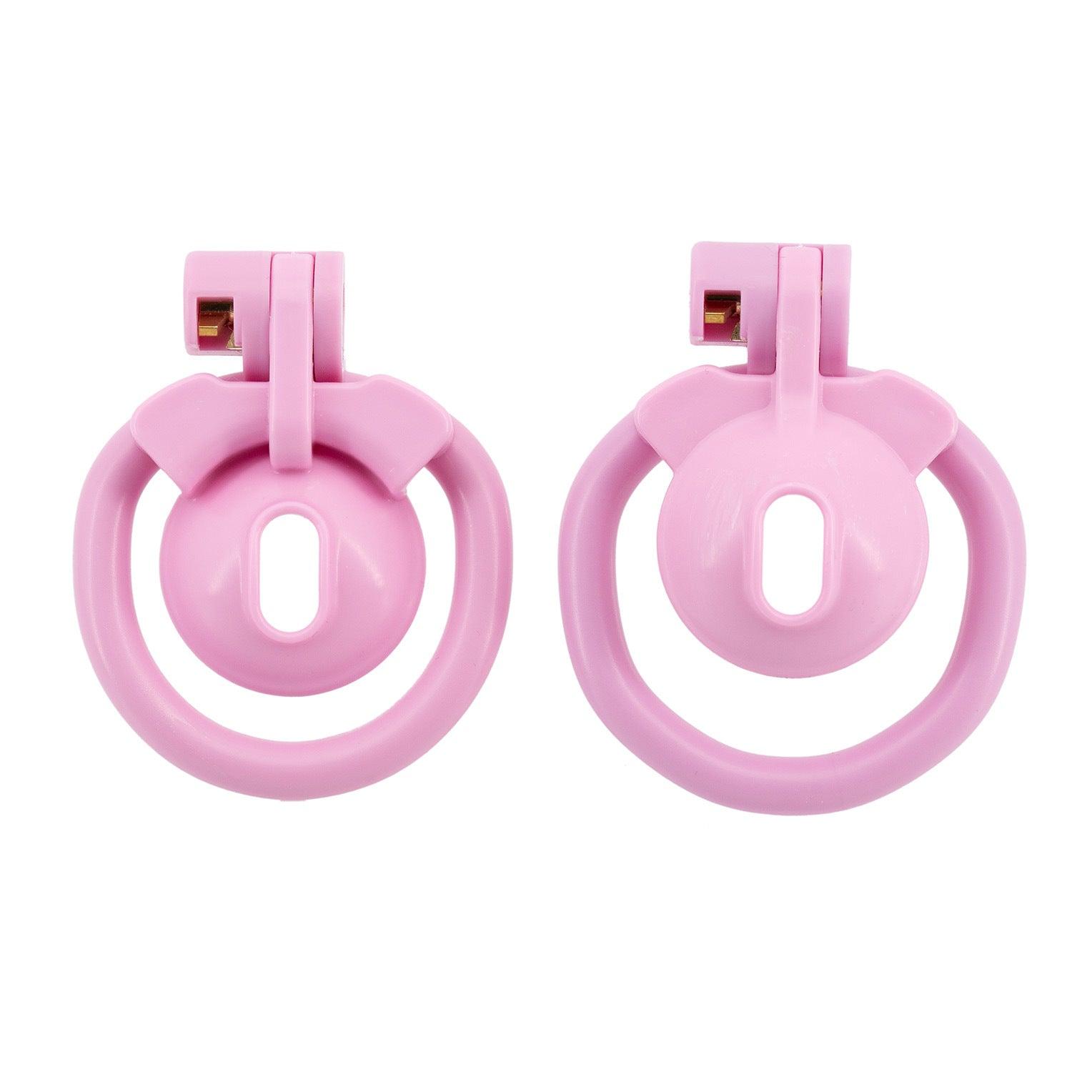 a pair of pink plastic rings on a white background