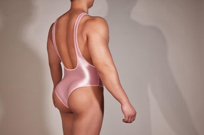 men's silky bodysuits, leotards, sissy singlets, and jumpsuits reveals a diverse array of lingerie, dancewear, roleplay costumes, and fashion-forward one-pieces, ranging from sensual satin and spandex to frilly, lace-adorned designs, catering to various preferences in intimate wear, performance attire, cross-dressing, and contemporary streetwear