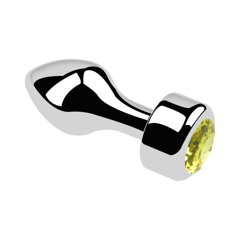 Metal butt plug with yellow gem and bullet head