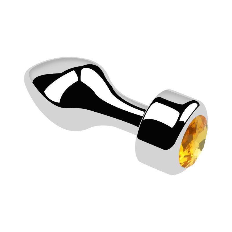 Metal butt plug with yellow gem and bullet head