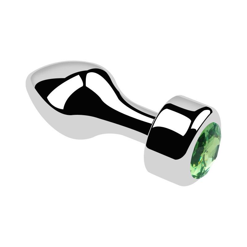 Metal butt plug with green gem and bullet head