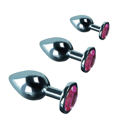 Metal butt plug kit with pink gems, angled view, sizes S, M, L