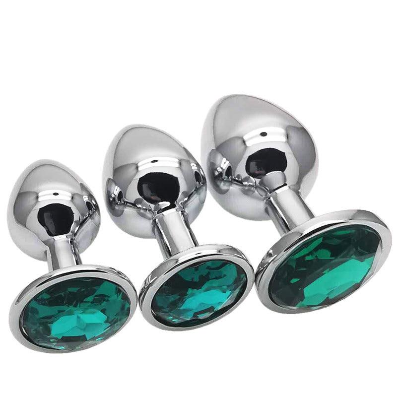 Metal butt plug kit with green gems, sizes S, M, L