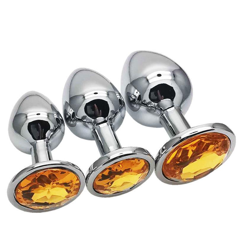 Metal butt plug kit with orange gems, sizes S, M, L