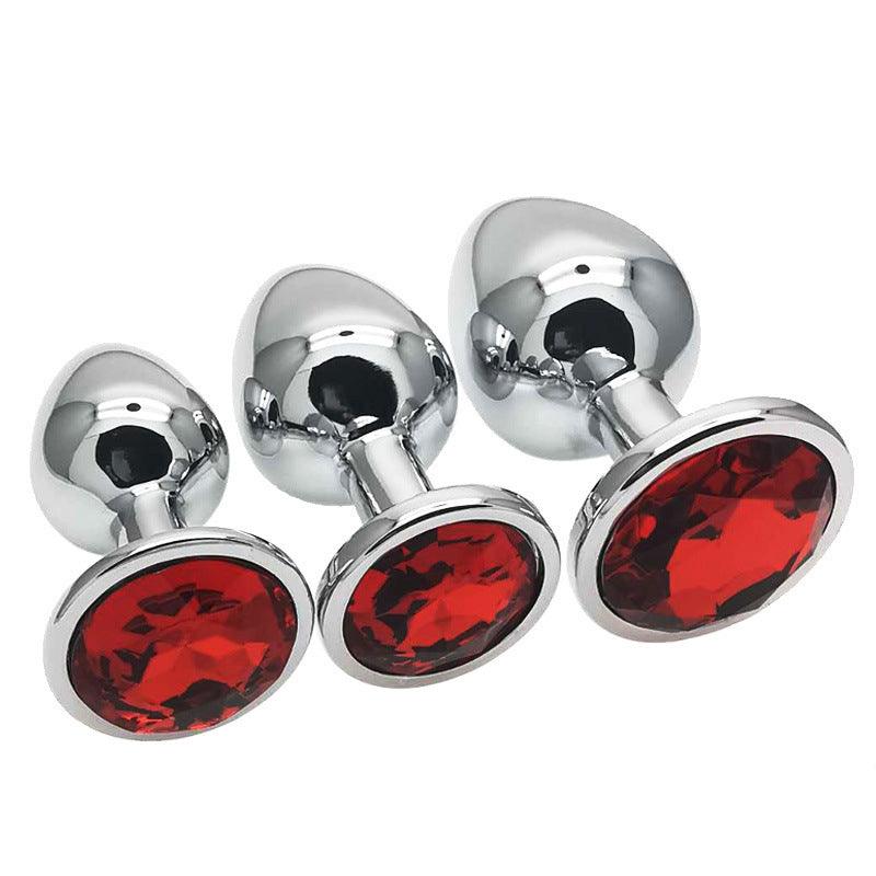 Metal butt plug kit with red gems, sizes S, M, L