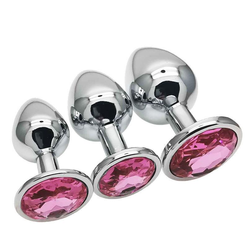 Metal butt plug kit with pink gems, sizes S, M, L