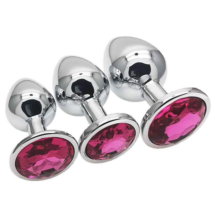 Metal butt plug kit with dark pink gems, sizes S, M, L