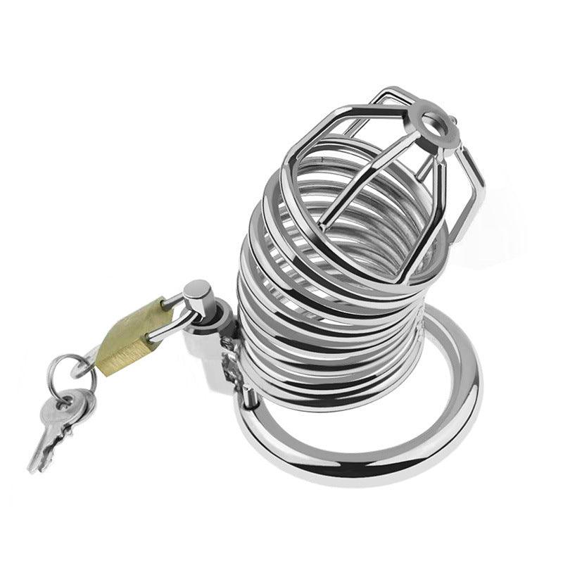 Angled view of metal chastity cage with padlock and keys