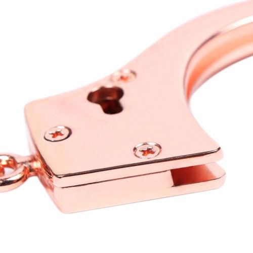 Rose gold handcuff lock with keyhole detail