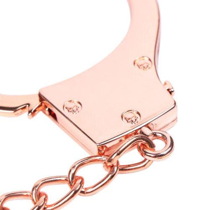 Rose gold handcuff chain and lock detail