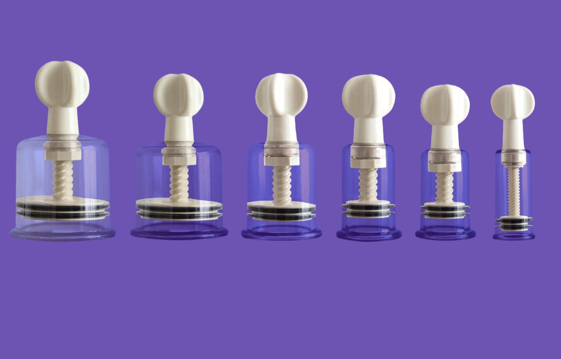 Set of six silicone nipple pumps on purple background