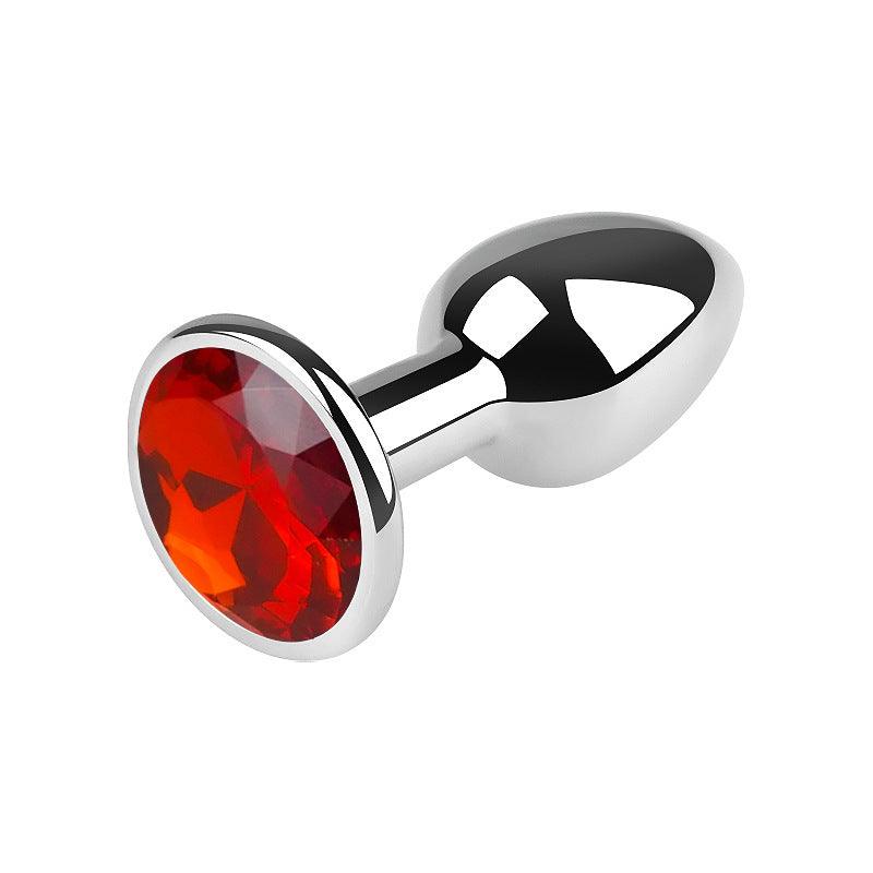 Silver metal butt plug with red gem, 2.5 inches