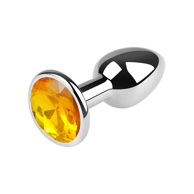 Silver metal butt plug with orange gem, 2.5 inches