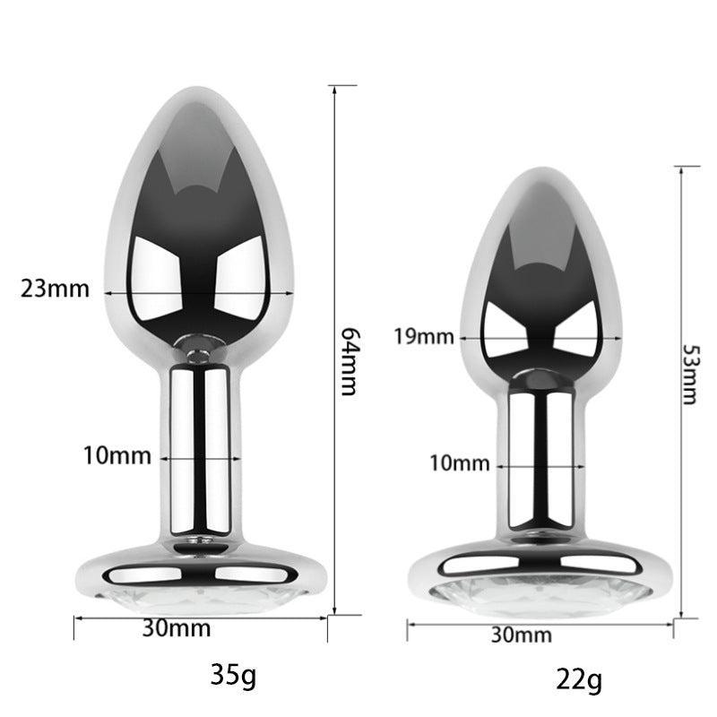 Size comparison of two silver metal butt plugs