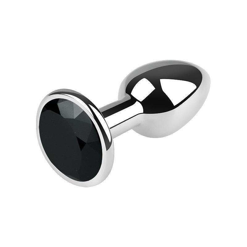 Silver metal butt plug with black gem, 2.5 inches