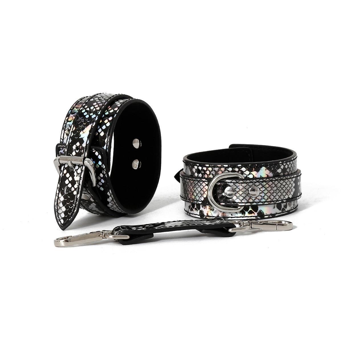 Black snake pattern cuffs with silver clasp